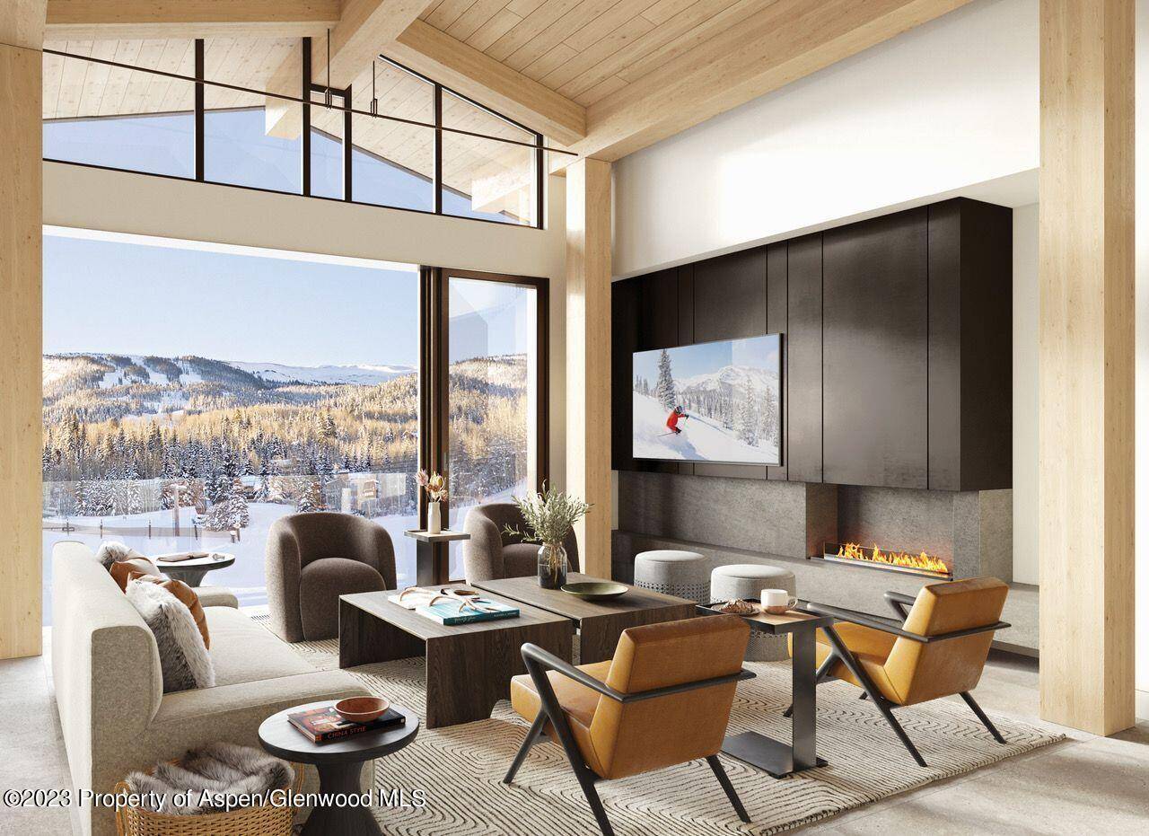 Penthouse residence with soaring vaulted ceilings, sweeping mountain views, expansive garden terrace, large operable window walls and infinity great room.
