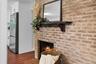 Every finish, from the warm brick to the sleek gold accents, was chosen to bring style and comfort into perfect balance.
