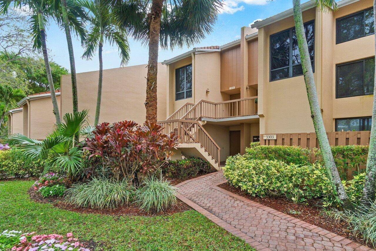 Welcome to this updated 2 story townhouse in the prestigious Boca West Country Club.