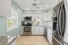 This gorgeous kitchen has plenty of storage and counter space!