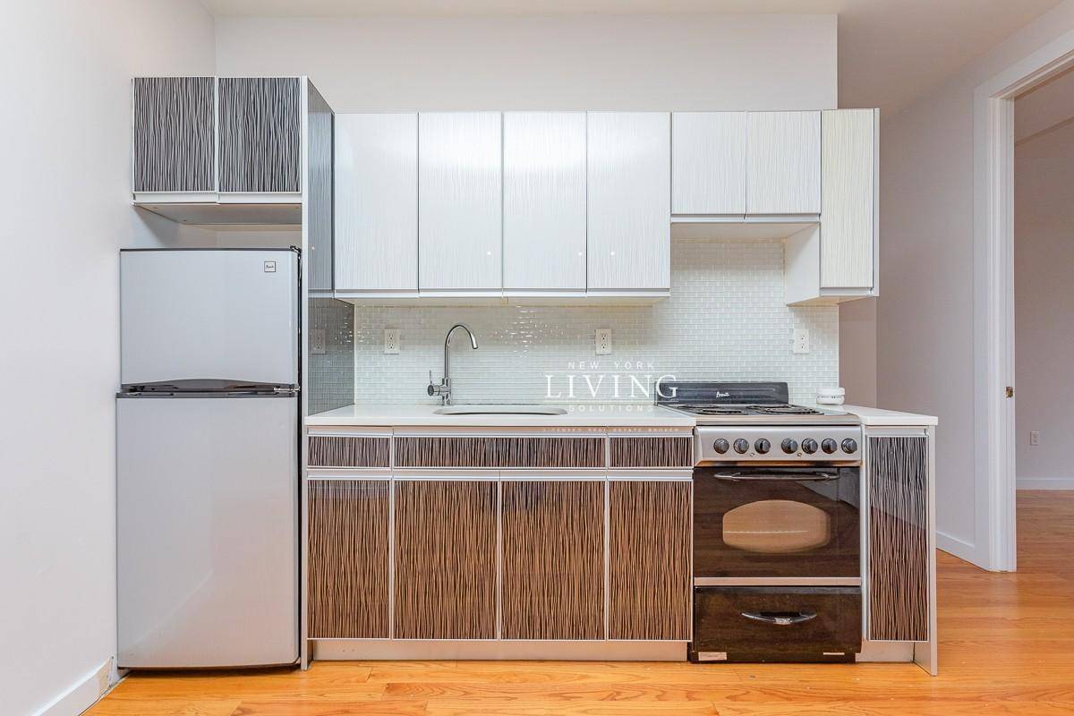 Reside in a gorgeous 3 bed 1 bath apartment with stainless steel appliances, hardwood floors, natural sunlight, modern features, and easy access to trains.