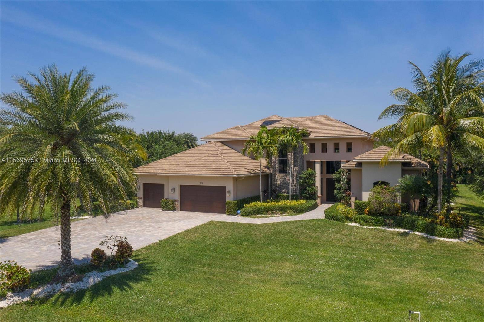 Welcome to the prestigious Plantation Acres where this AMAZING pool house of 5 bedroom, 5 bathroom office is sitting on a 1.