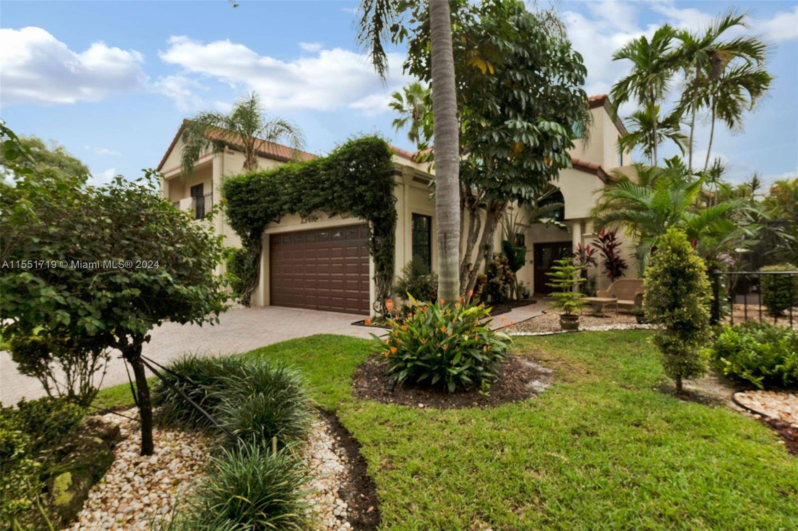 MAGAZINE WORTHY AND STUNNINGLY RENOVATED TWO STORY HOME IN PRESTIGIOUS VALENCIA, BOCA POINT GATED COMMUNITY.
