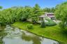 Sweeping views reveal the stunning relationship between the residence, the pond, and the surrounding landscape.