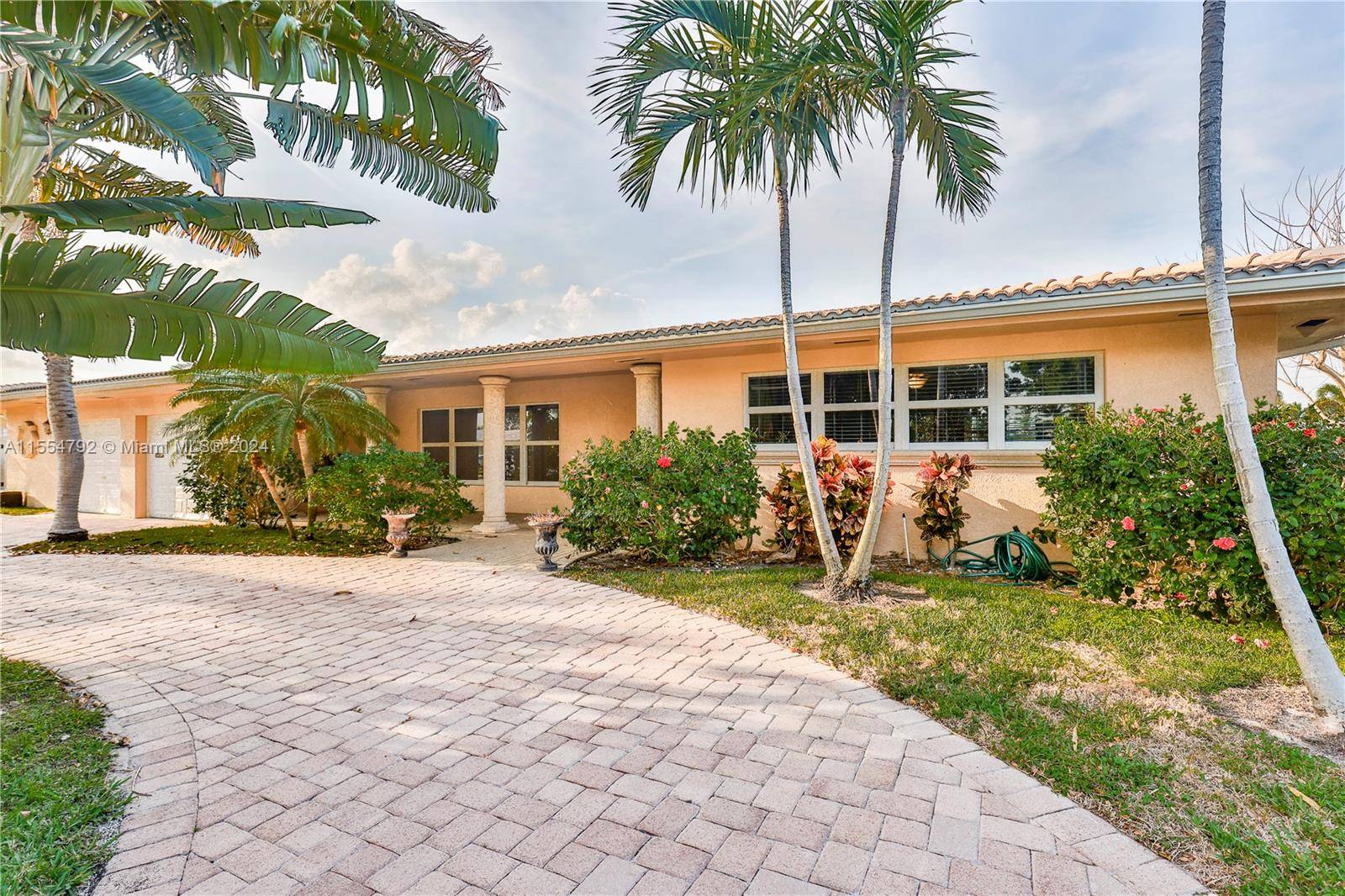 Water front oversize heated pool home with huge backyard in beautiful Lighthouse Point.