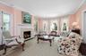 3 Sets of French doors, hardwood floors, wood burning fireplace and generous sized windows throughout