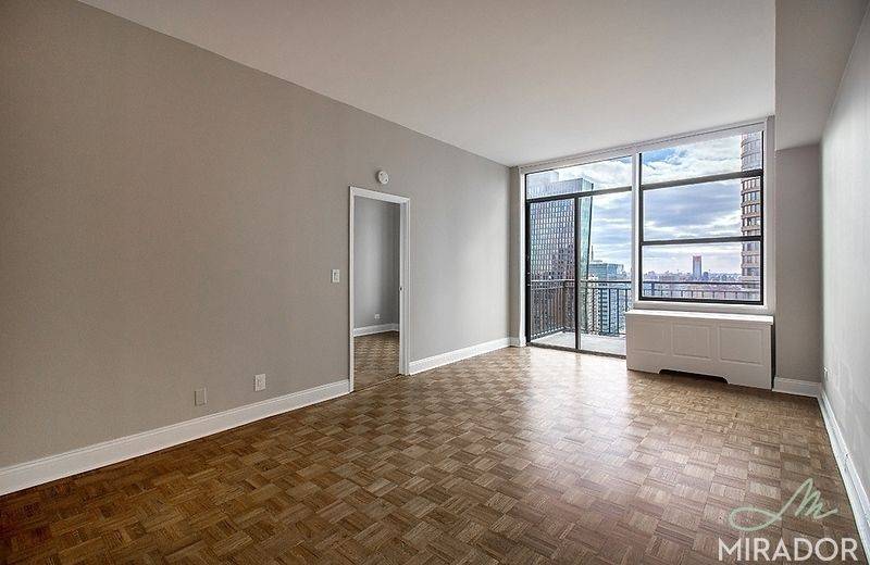 Beautiful 2 BR 1. 5 Bath corner unit featuring a south facing balcony with unobstructed views of the water and the Empire State Building.