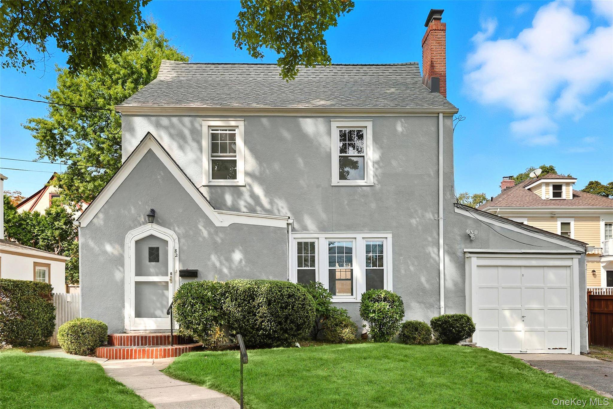 Charming 1930 Tudor brimming with character and original architectural details !