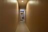 Hall with light tile patterned floors