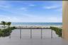 Main floor terrace highlights 40 feet of outdoor living space featuring Longboard™ accents to compliment to azure blue Gulf