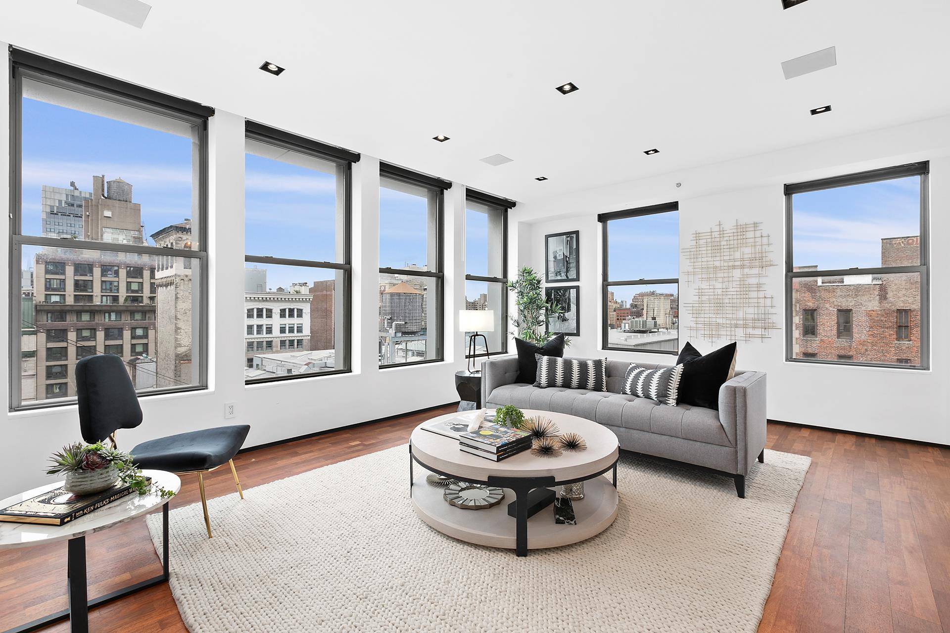 Secluded townhouse in the sky with enormous private roof deck, stunning views and amazing light.