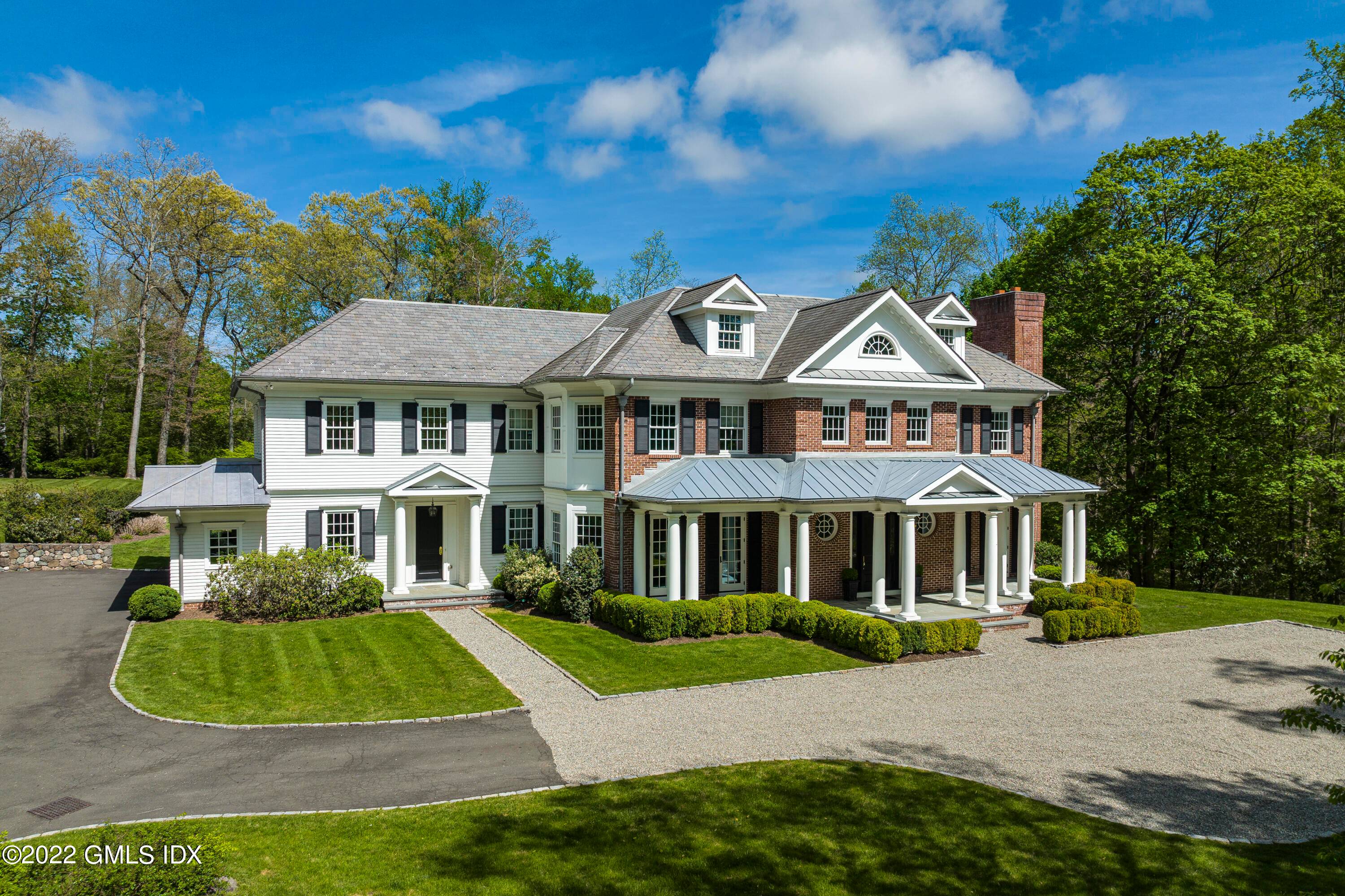 Stately six bedroom Georgian Colonial, custom built in 2012, sits atop 3.