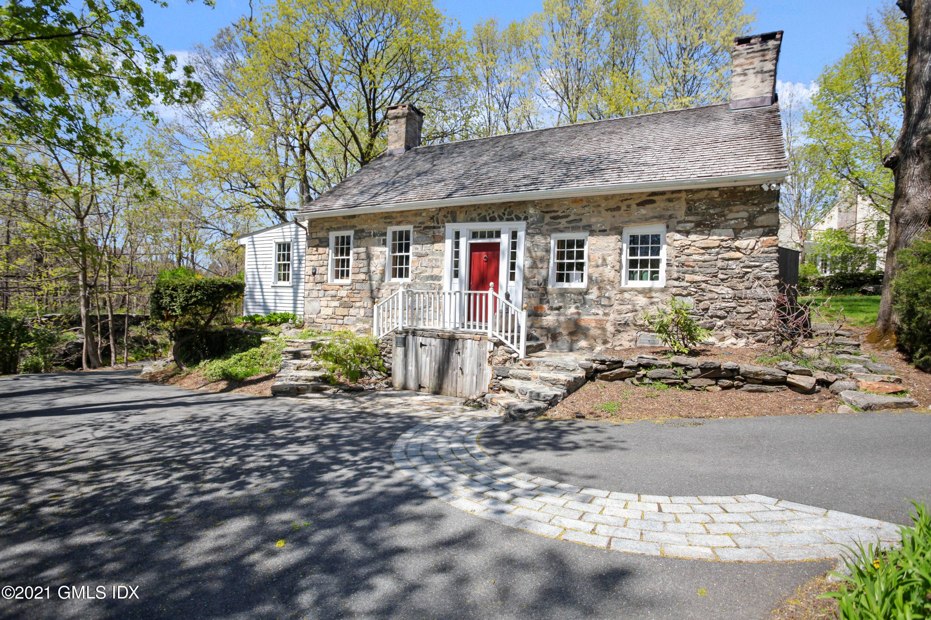 The Fieldstone Solomon Merritt House Beautiful parklike property featuring a historic stone cottage and a newly renovated carriage house both enjoying Town Water and Town Sewer.