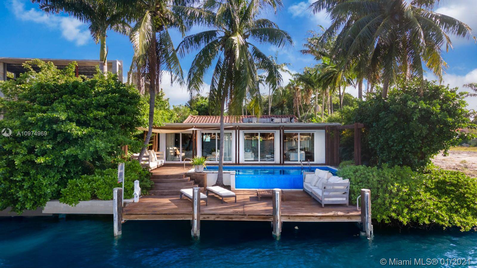 Breakfasts by the pool and moonlit dinners overlooking Biscayne Bay await at this 4Bed 4 Bath waterfront bungalow.