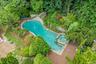 Aerial view of property's location with a pool area