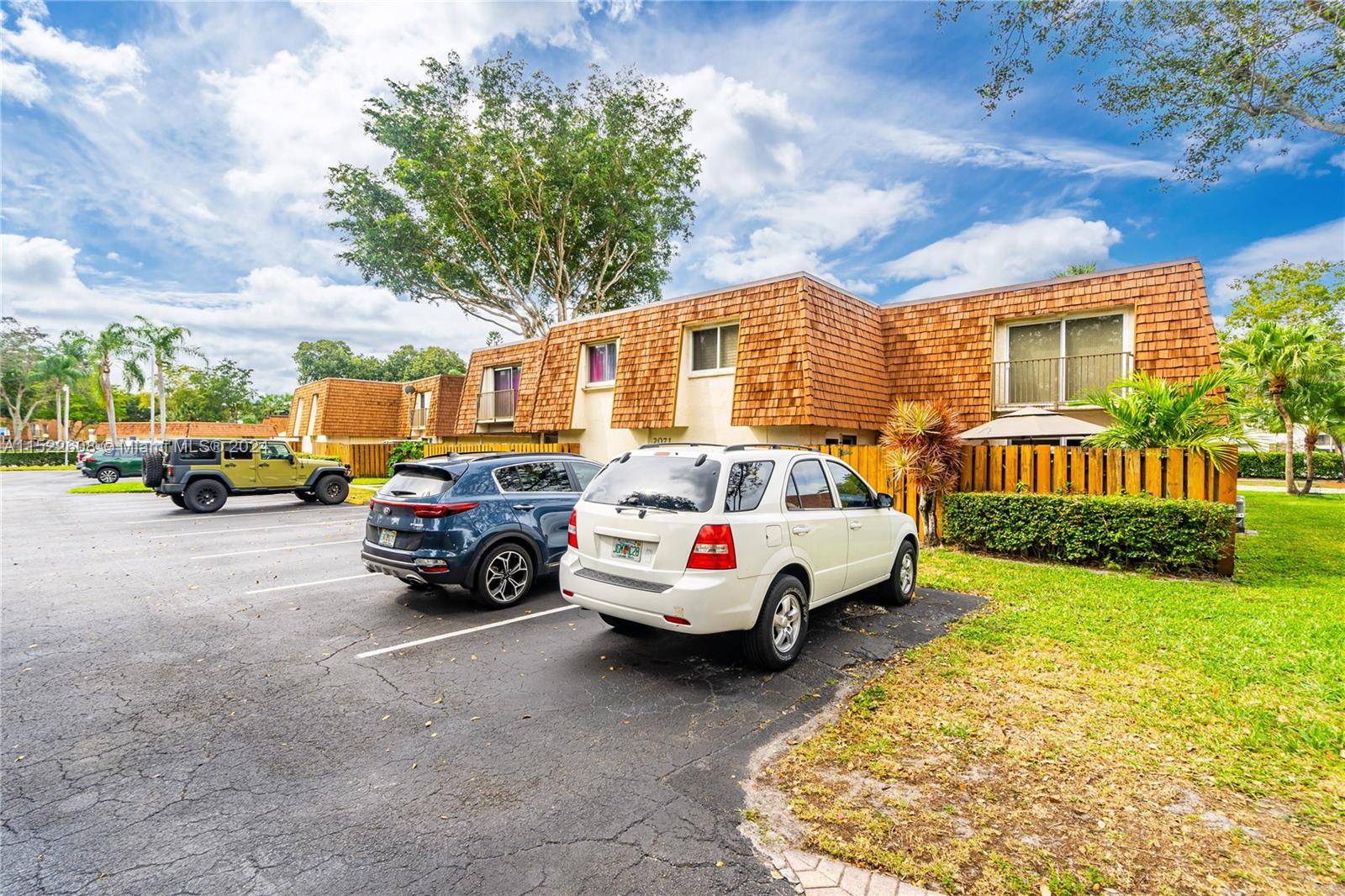 Beautifully renovated Davie townhome featuring hurricane impact windows doors 25, 000 upgrade large paved patio with private entry assigned parking right outside the unit.