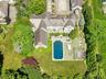 A resort-style home with pool and manicured grounds for the ultimate private sanctuary. This architectural gem perfectly blends timeless elegance with