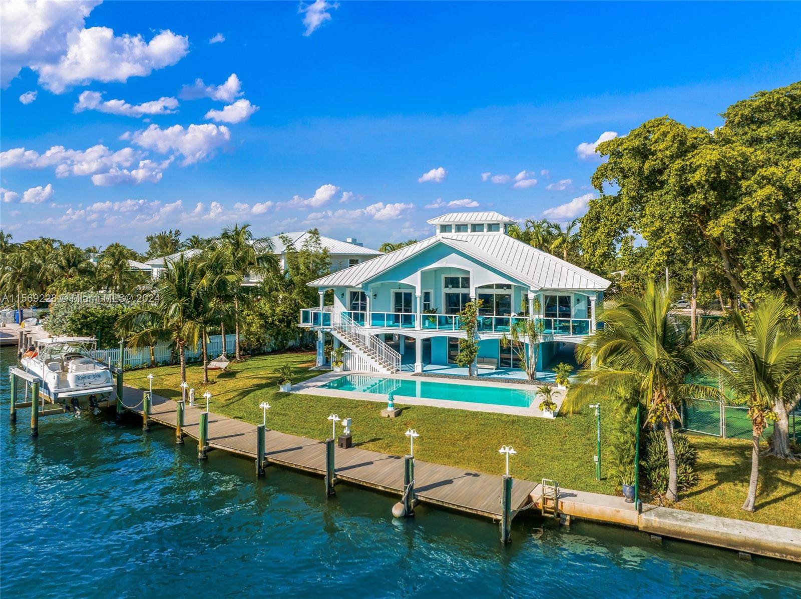 Welcome to this waterfront estate situated on a spacious 12, 815 SF lot, with 120 feet of dock space along Biscayne Bay, perfect for a yacht of 80 feet.