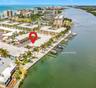 This aerial view shows the unit location and the boat slip with lift location that conveys with this unit.