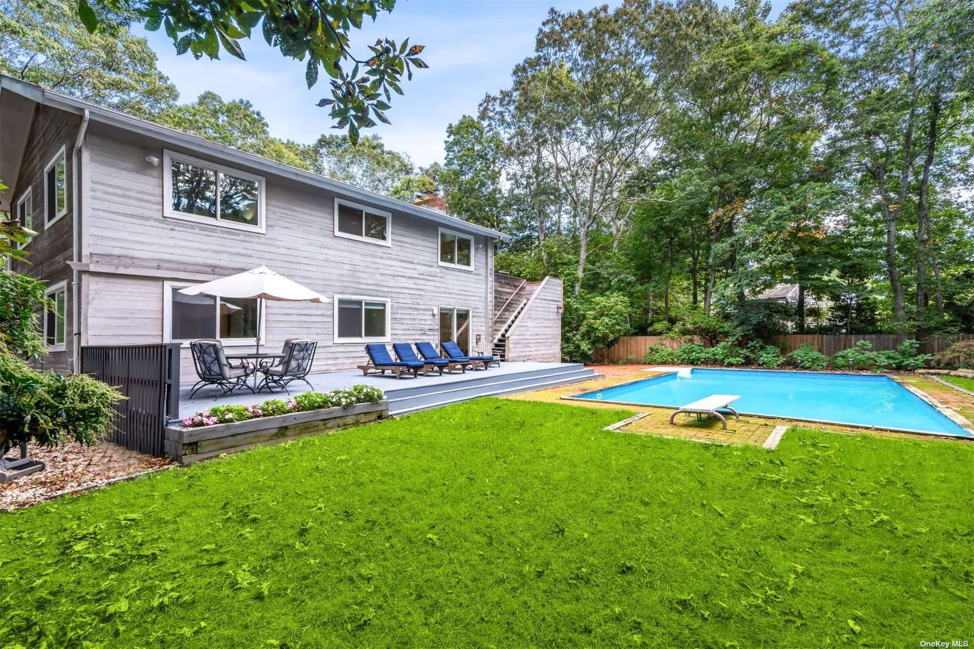 Rental Registration 23 1199 Step into the tranquility of 4 Underwood Drive, located in the exclusive Clearwater Beach community in East Hampton.
