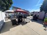 Paved patio area with a privacy fence