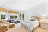 Carpeted bedroom with access to exterior