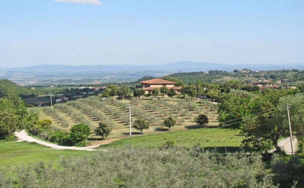 For sale in Montepulciano restored land house with large panoramic terraces, gardens and olive grove. Swimming pool and beautiful views.
