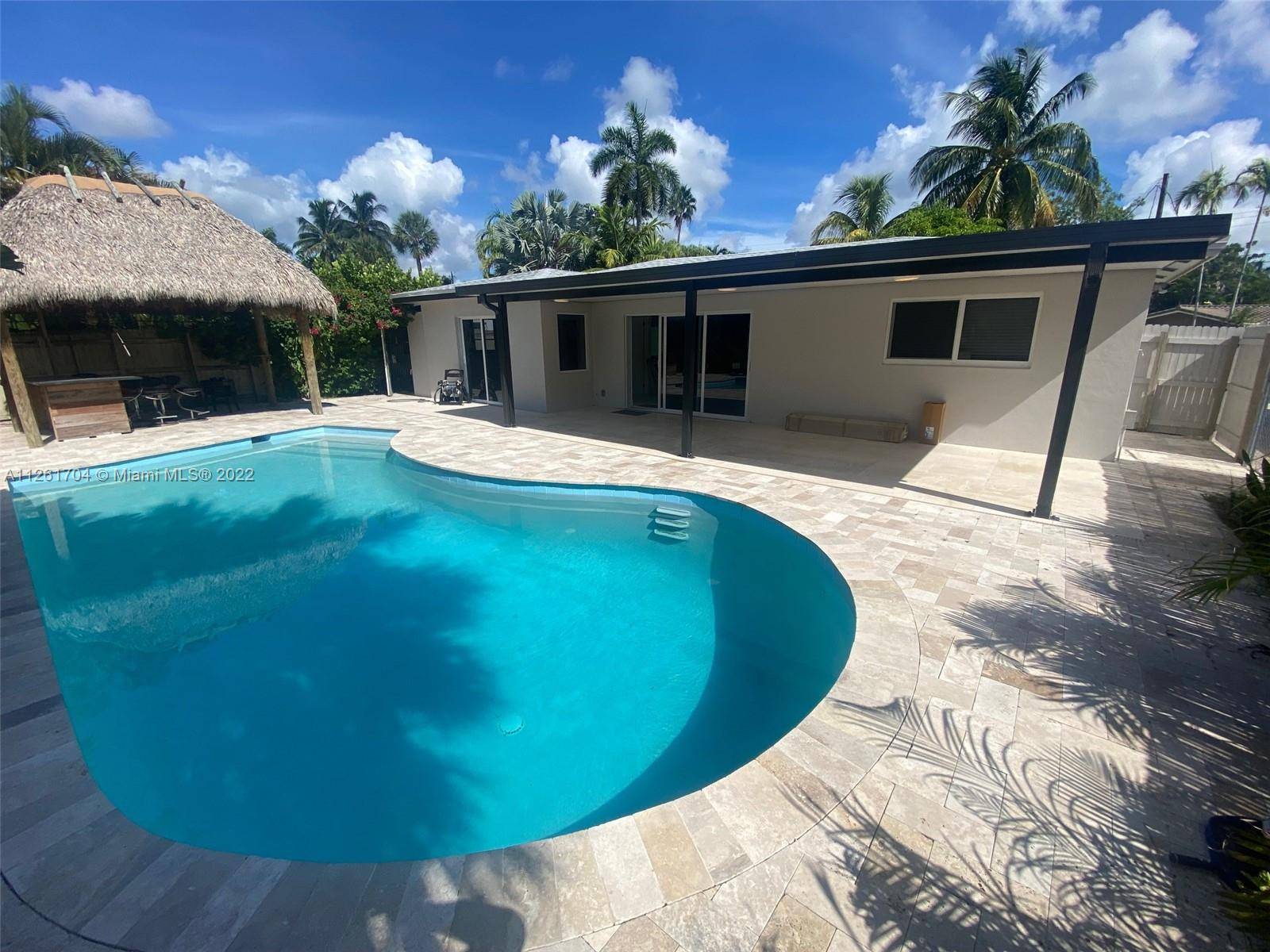 Fully remodeled paradise, nice and ready to move and enjoy fully, new roof, flooring, new converted garage, new impact windows, tiki bar, paved pool area, new sea wall completed a ...