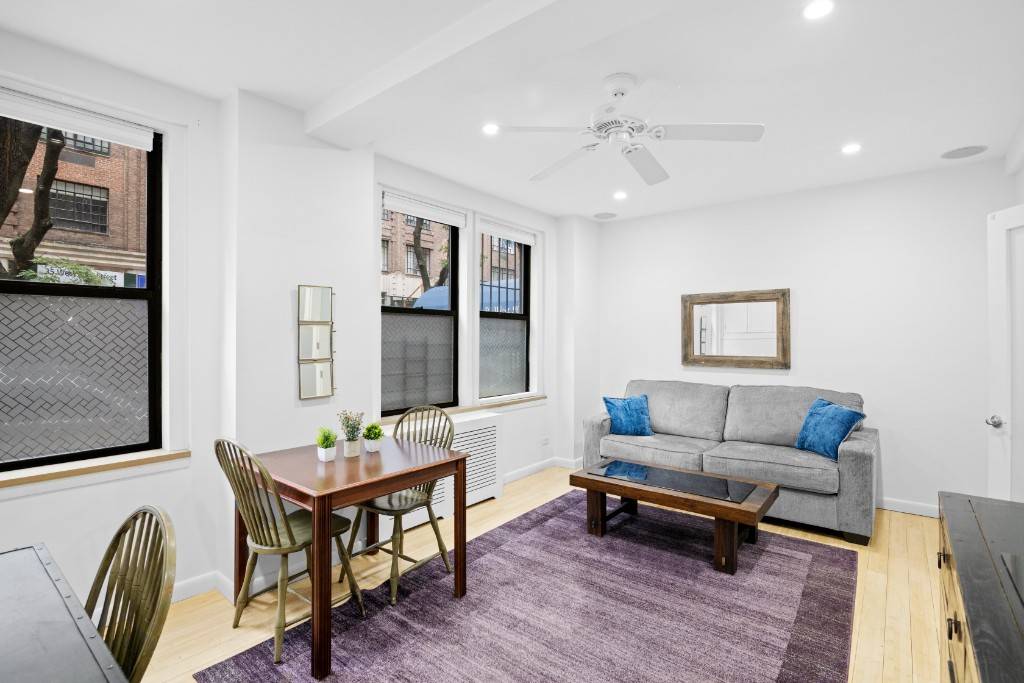 This high first floor one bedroom condo is located in a boutique prewar building on a beautiful tree lined street just half a block from Central Park.