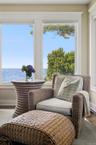 Living area featuring a water view and wood finished floors