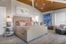 Upper level primary bedroom with private balcony