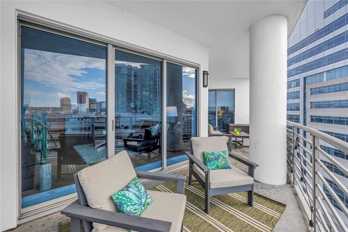 Enjoy the Outdoor Views and Sounds of the Vibrant City from 12 Floors Up. COOL!