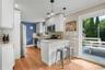Kitchen featuring white shaker cabinetry and stainless steel appliances.