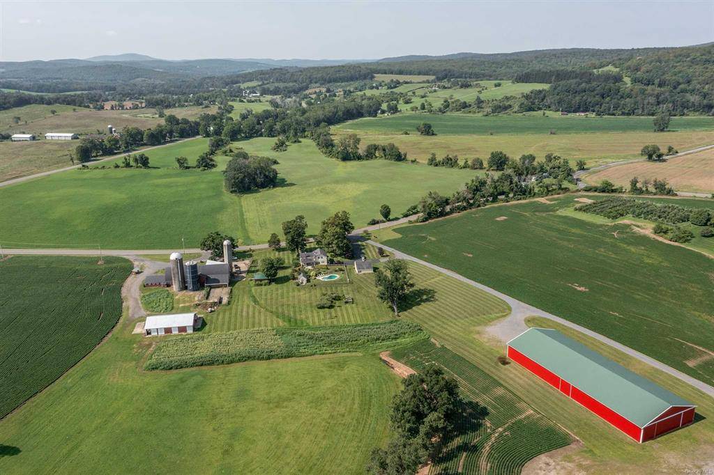 Beaver Mountain Farms. Picturesque c1900's farmhouse with multi barn complex on 41 acres with pond.