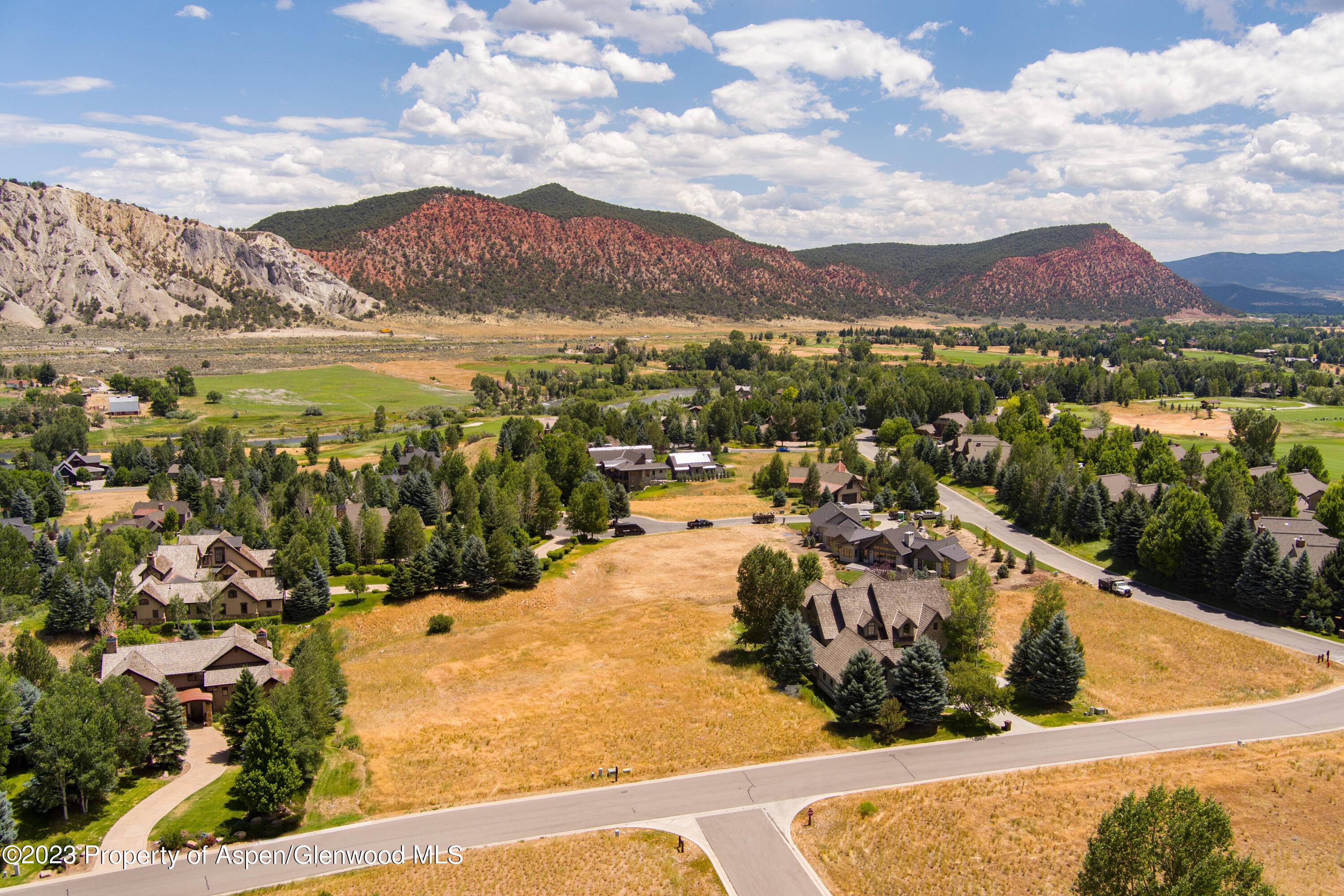 Enjoy beautiful sunset views of the red bluffs, sunrise views, and stunning mountain views down valley from this beautiful ½ acre lot in the Aspen Glen Club.