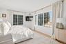 Bedroom featuring wood finished floors and baseboards