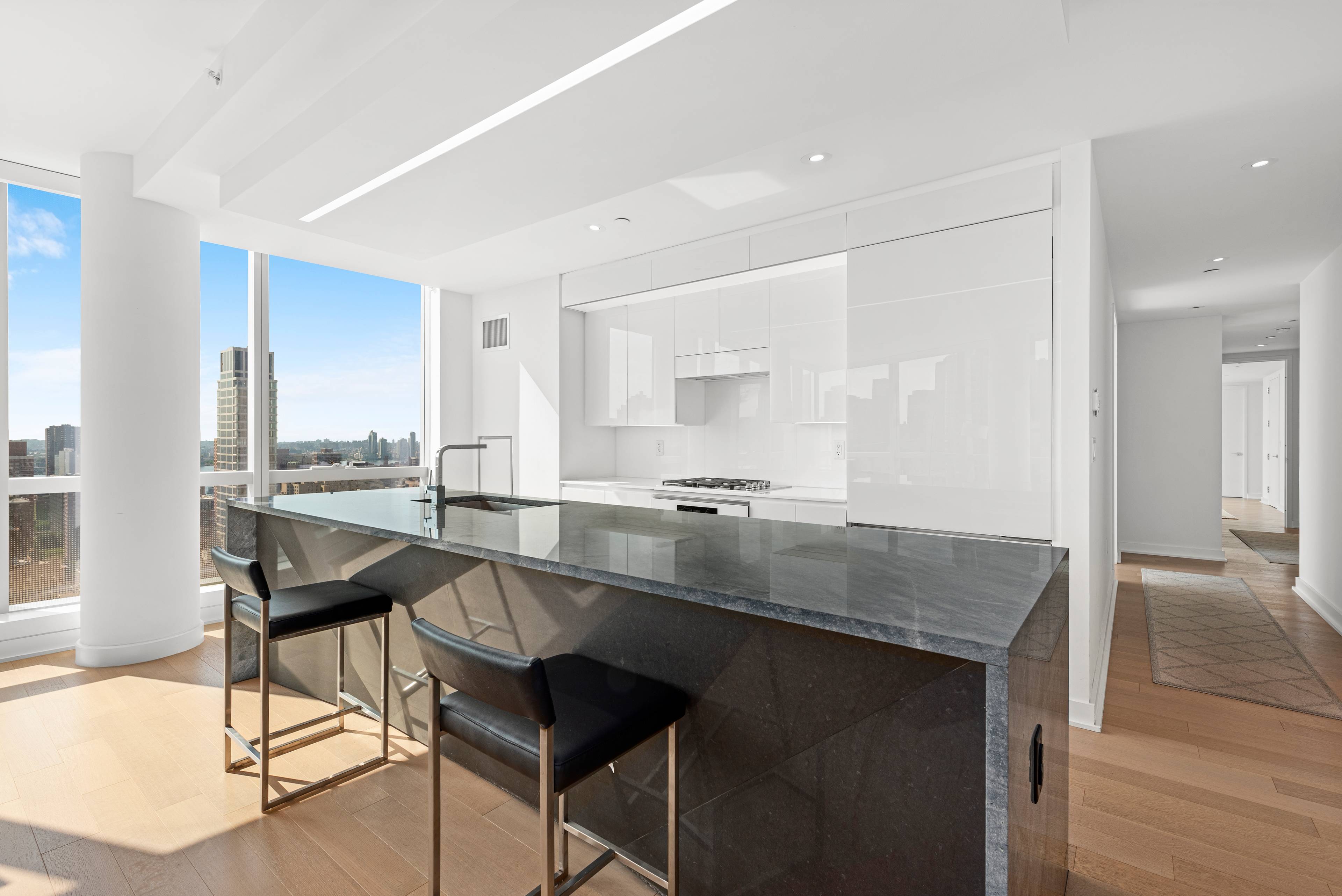 Floor to ceiling skyline city views from this huge newly constructed three bedroom plus study, three full baths.
