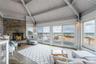 Sunroom / solarium featuring beamed ceiling