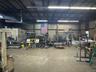 Garage featuring metal wall and a workshop area
