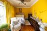 Bedroom featuring ceiling fan, crown molding, and parquet flooring