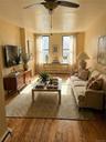 Hardwood flooring. Two windows.
