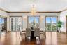 Formal dining with chandelier and city views