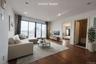Living room with dark wood-type flooring and recessed lighting