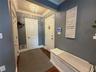 Entry way with coat closet and access to garage from the house.
