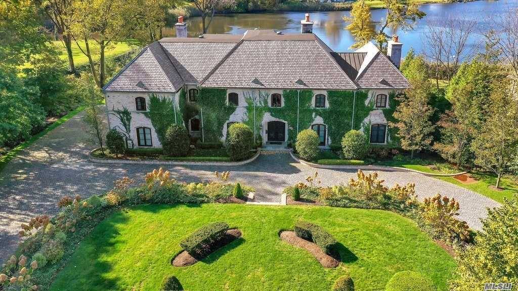 Six bedroom 8, 000 SF French Chateau style home on Leeds Pond !