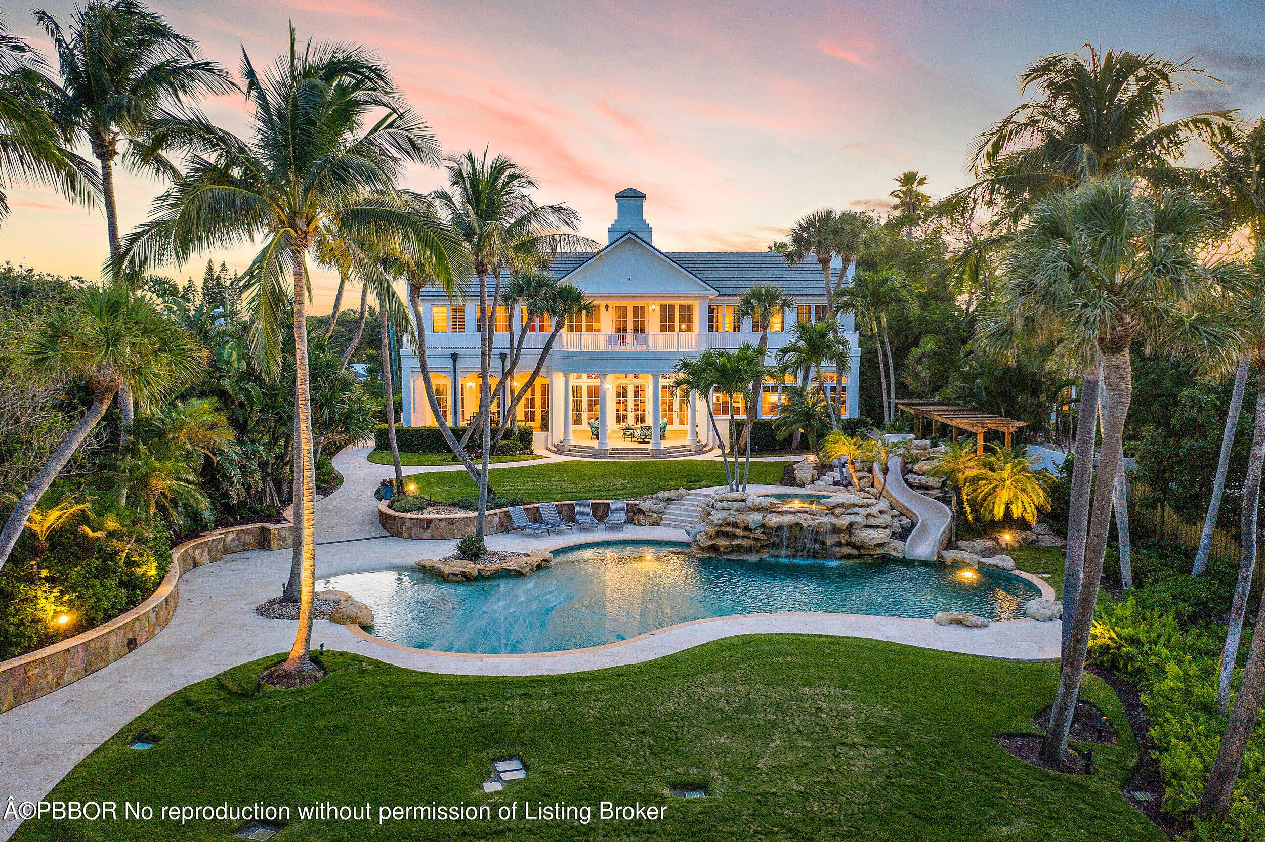 On 100 feet of blue, Intracoastal waters this plantation style estate on 3.
