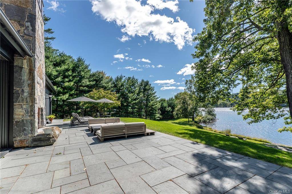 Spectacular summer setting for July and or August at this architectural masterpiece on shimmering Copake Lake.