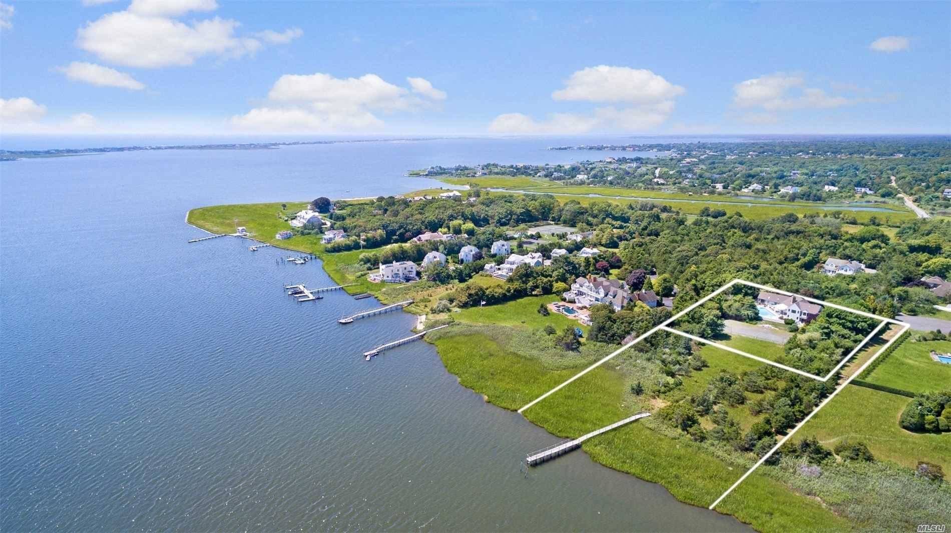 Spectacular 3 plus acre Bayfront property with over 200ft of water frontage.