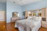 Primary bedroom with access to walk-in closet and ensuite bath