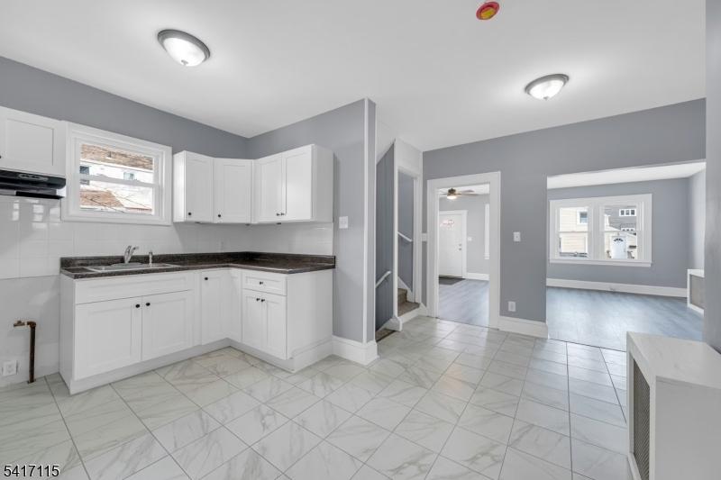 Kitchen with ceramic floors.
